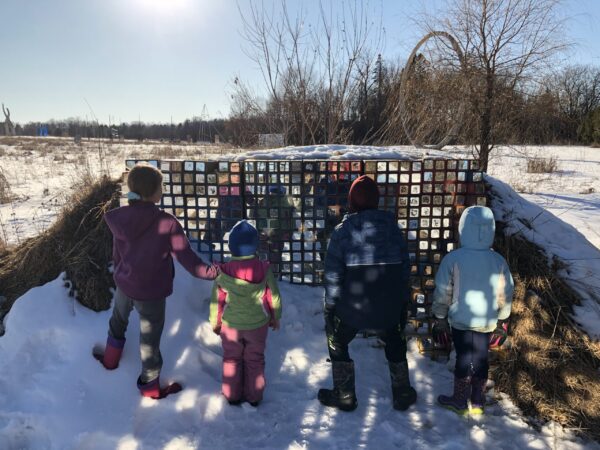 Kids at mirror sculpture at Franconia. 