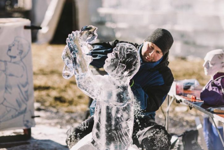 Ice carver working on sculpture. 