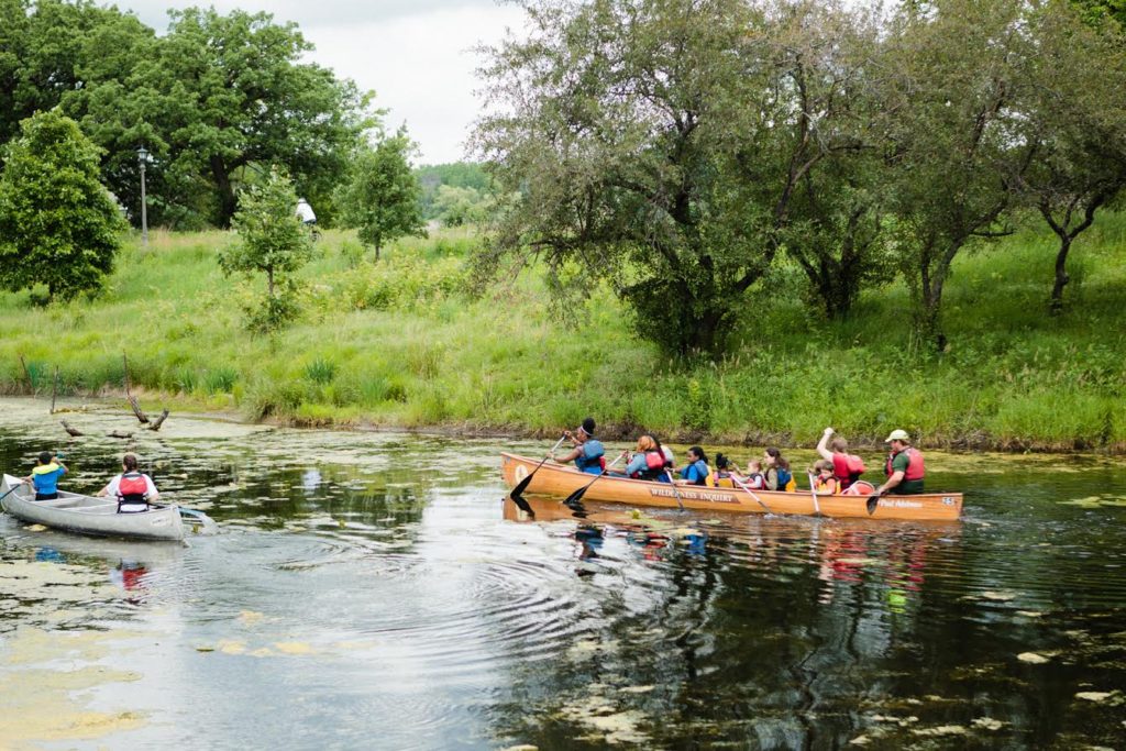 canoes with people on the lake