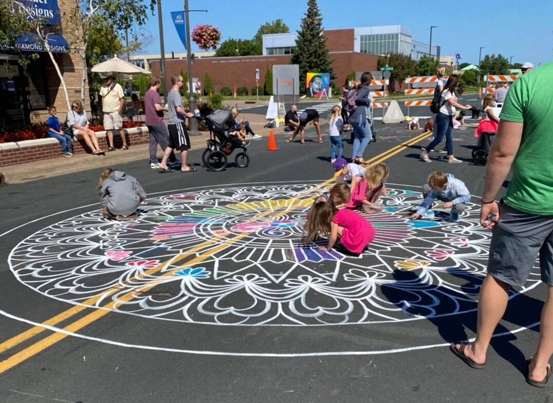 kids coloring mandala at Chalkfest Arbor Lakes