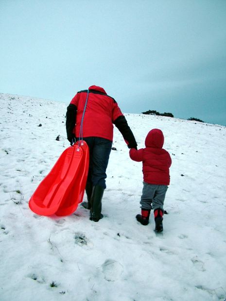 walking up sledding hill