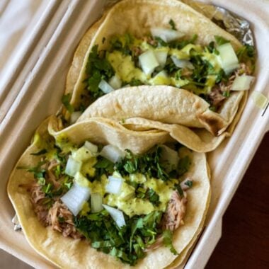 Tacos in a take out box.