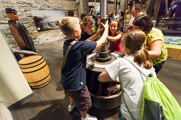 children engaging with a museum exhibit
