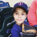Boy at Minnesota Twins Game Wearing Twins Hat and Holding Baseball Glove