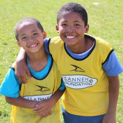 2 smiling Children participating in Free Sanneh Foundation Soccer Camp