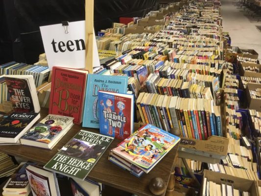 Books on table at Book 'em Used Book Sale