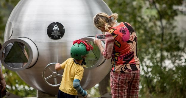 woman and boy exploring sculpture at Silverwood Park