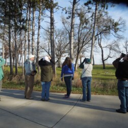 Washington County Parks bird hikes, bird watchers looking up in the air.