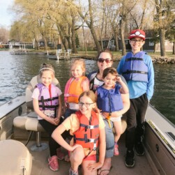 Family Fishing in Boat on Minnesota Lake