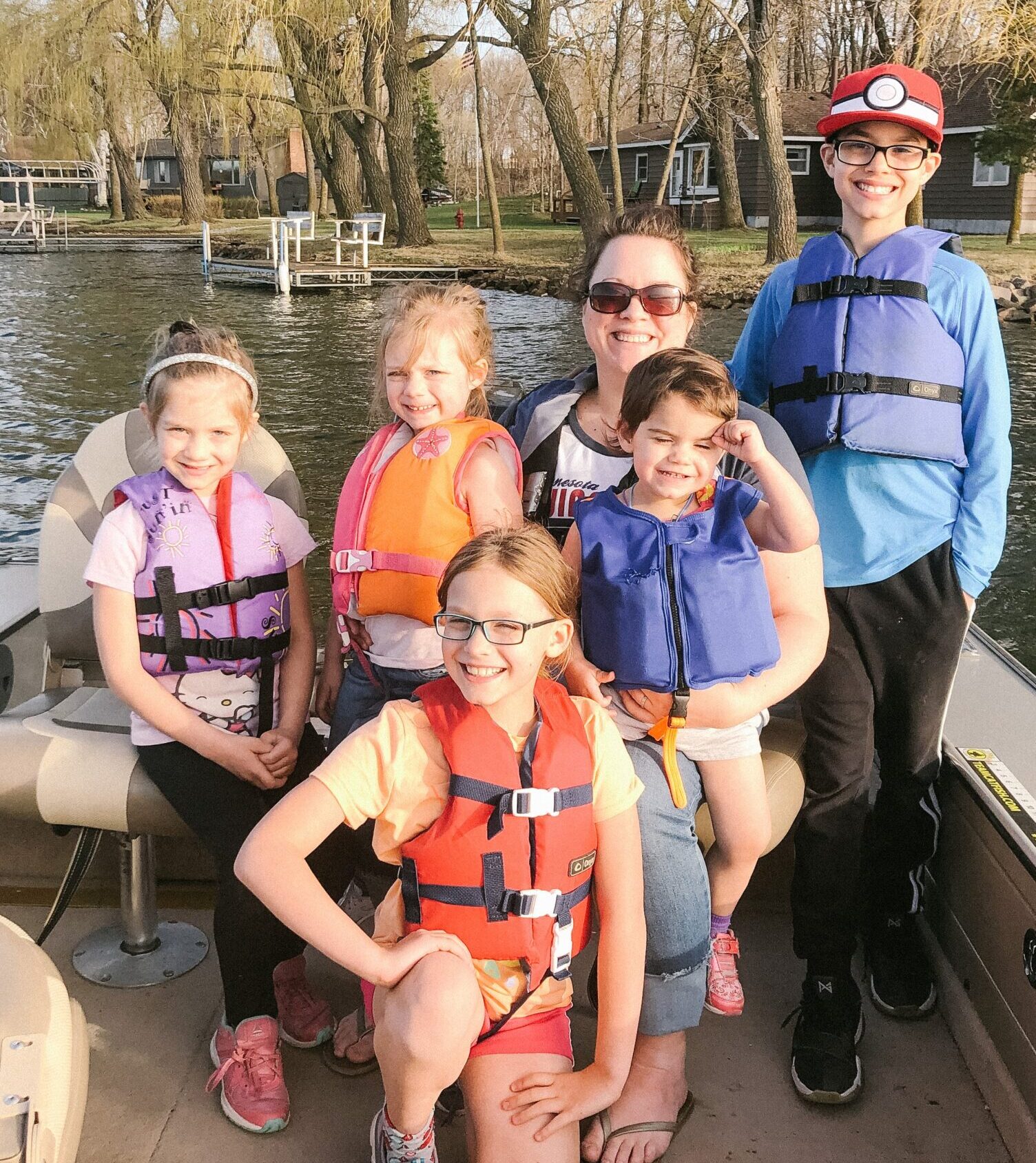 Family Fishing in Boat on Minnesota Lake.