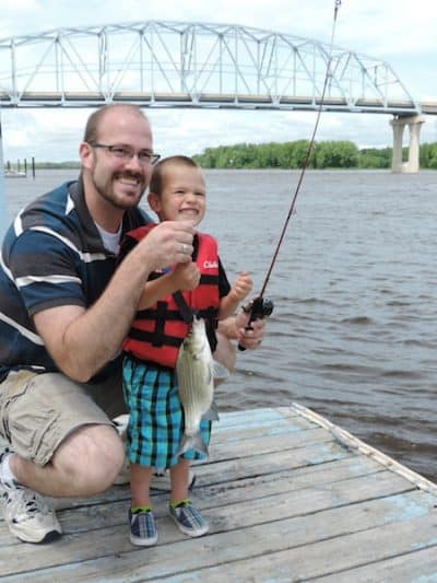 Boy and Father fishing on Mississippi River in Wabasha