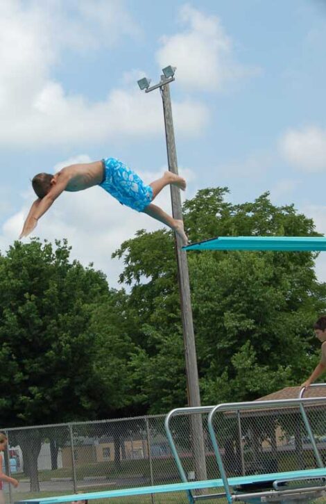boy diving off diving board