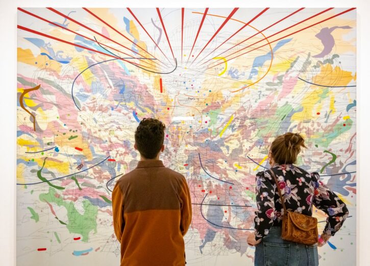 man and woman looking at painting in Walker Art Center.