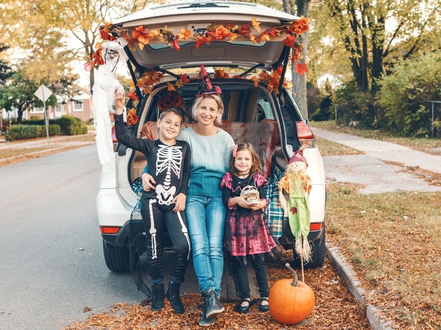 Mother and Kids at car for Trunk or Treat