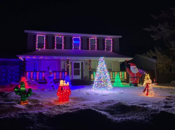 a house decorated with christmas lights.