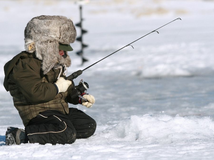 child ice fishing.