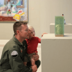 Military family enjoying a museum.