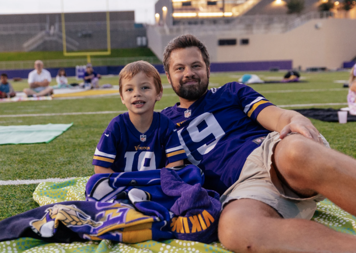 Father and son in Vikings jerseys