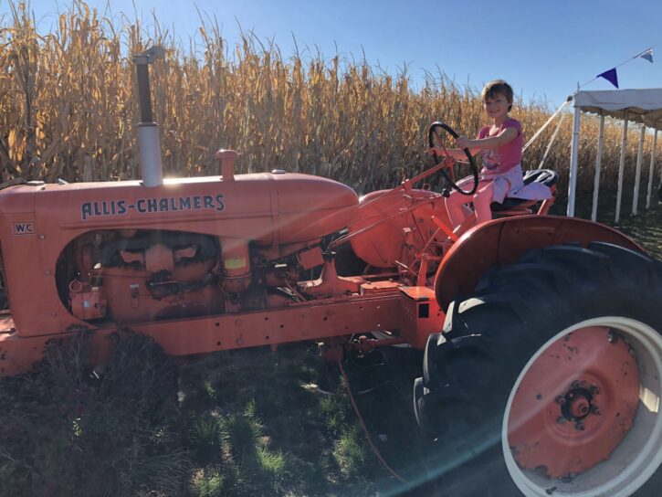 girl on tractor at Twin Cities Corn Maze