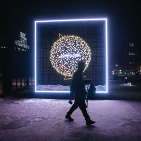 Great Northern outside lights with person walking.