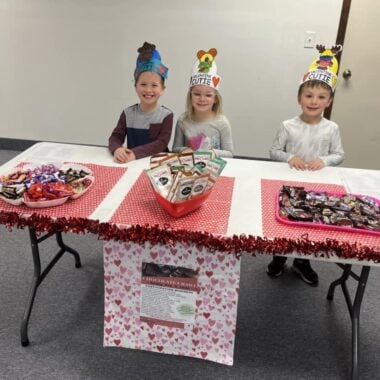 Cold Spring Chocolate Crawl kids handing out chocolate.