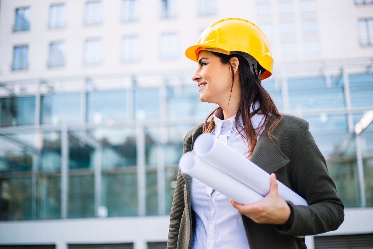 female engineer with hardhat and plans