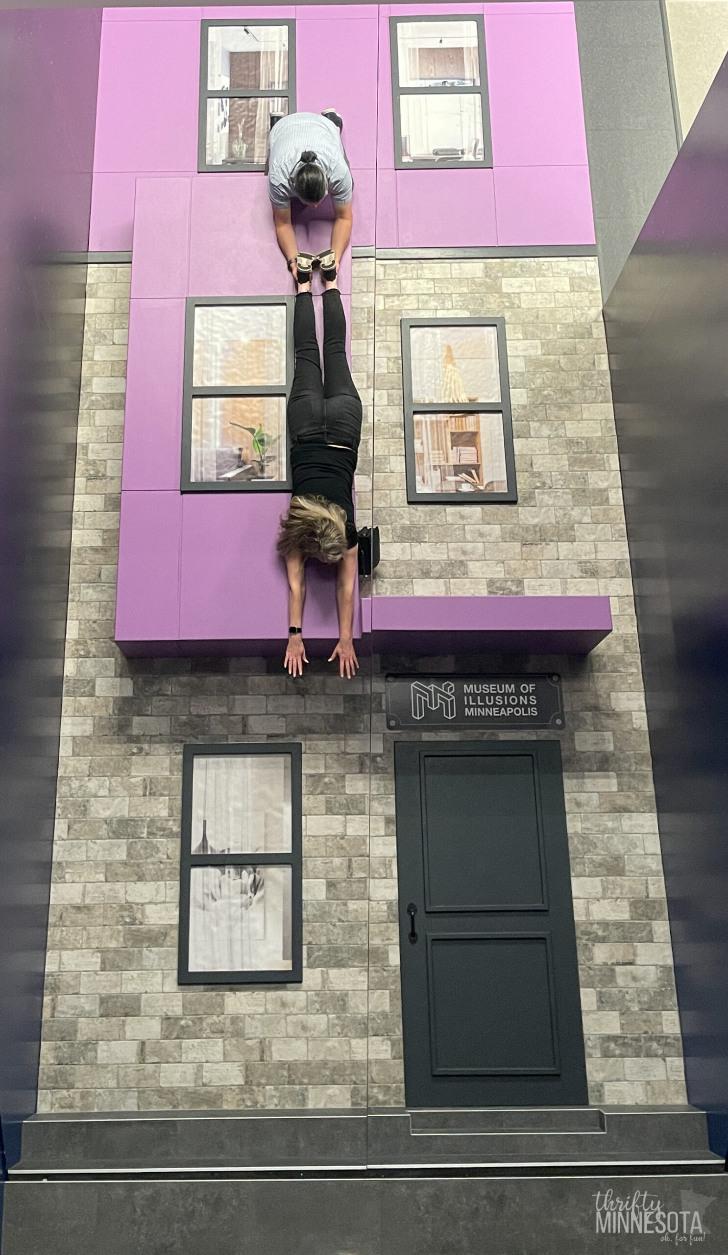 Museum of Illusions Hanging from a Building