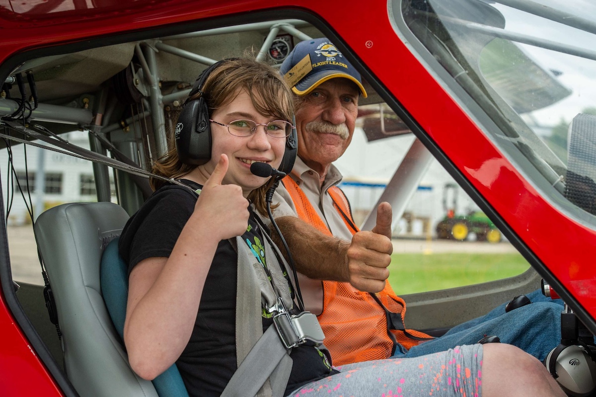 Girl on Young Eagles Flight with airplane pilot.