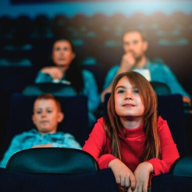 family at movie theater.