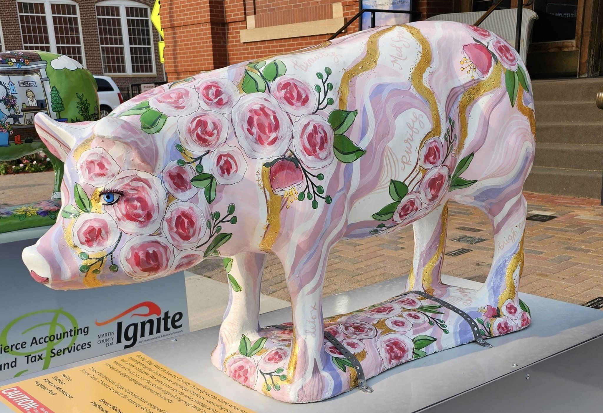 Martin County Hog Statue Painted with Roses.