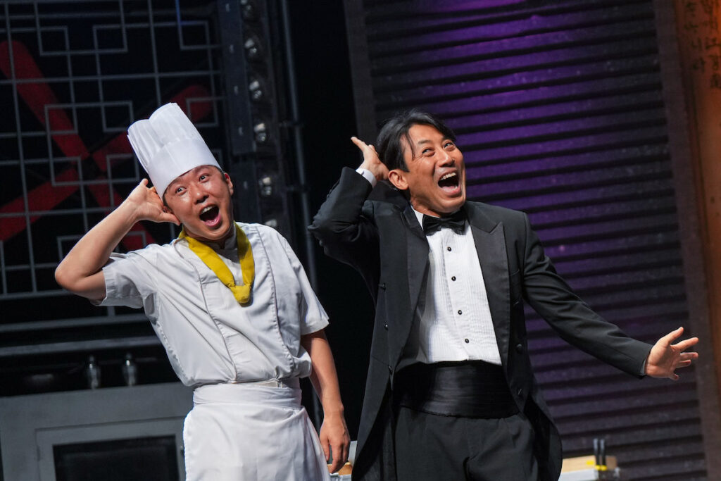 Two actors on stage in The production of Cookin’ at The Children’s Theatre Company. 