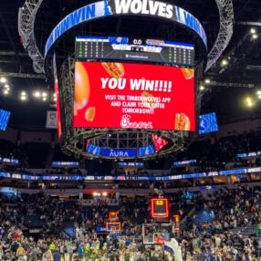 Timberwolves Free Chick-fil-A offer on big screen at Target Center.