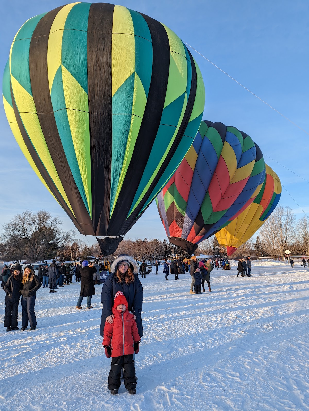 Hudson Hot Air Affair Mother and son in front of balloons.