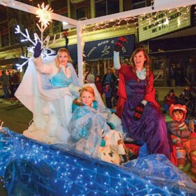 Bold and Bright Parade with characters on a float.