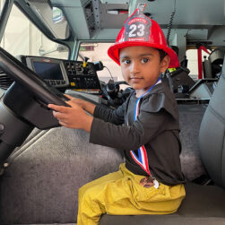 Child in Minnetonka Fire Truck.
