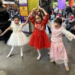 3 girl dancers posing for Lunar New Year.