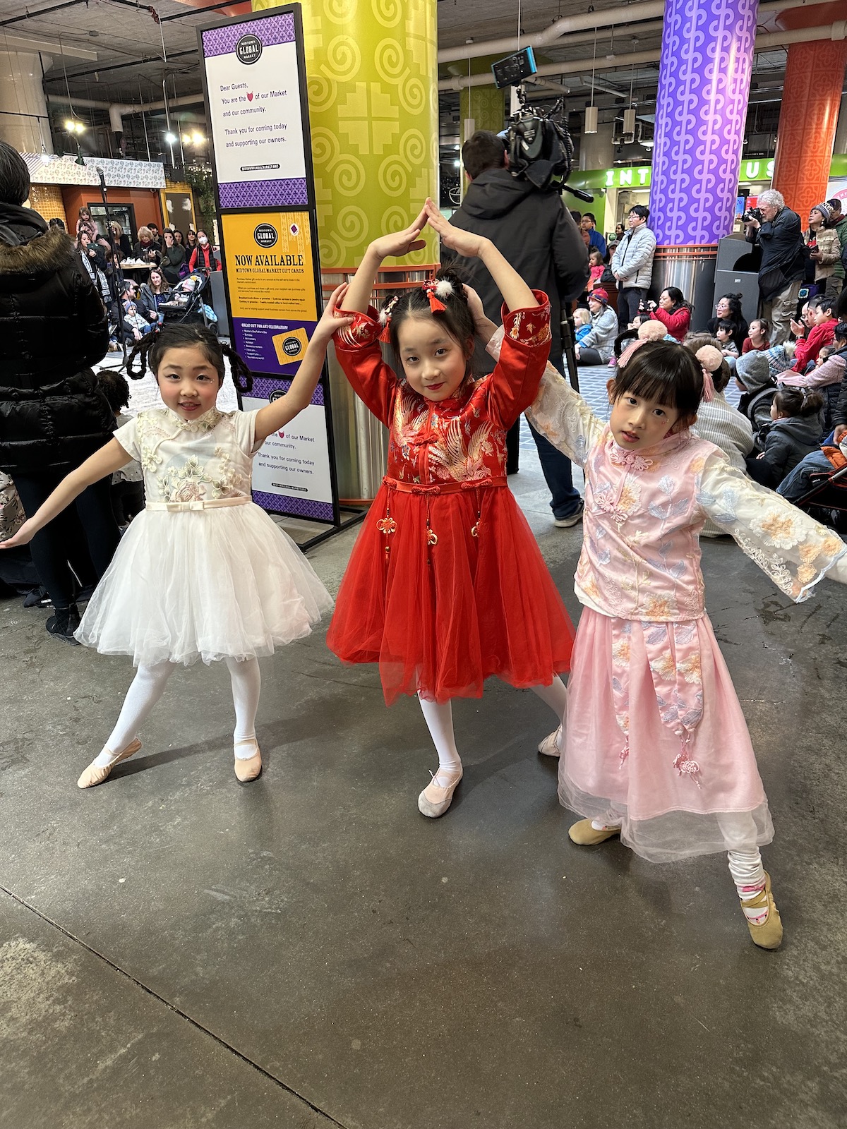 3 girl dancers posing for Lunar New Year. 