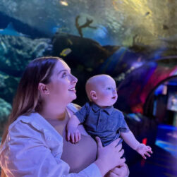 Mom and son looking at SeaLife Aquarium in wonder.