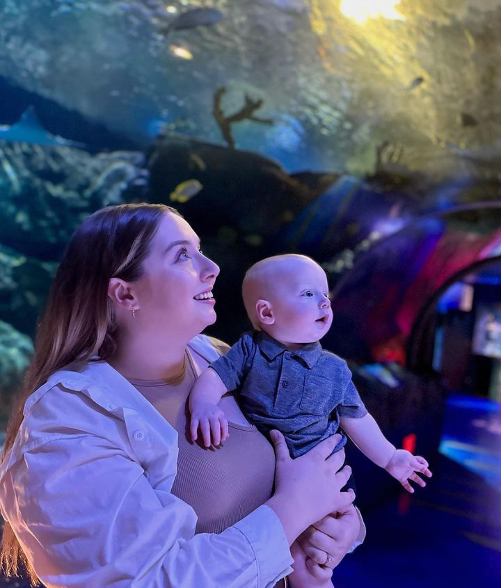 Mom and son looking at SeaLife Aquarium in wonder. 