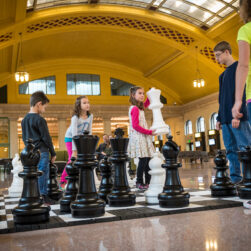 Kids playing life size chess at Union Depot.