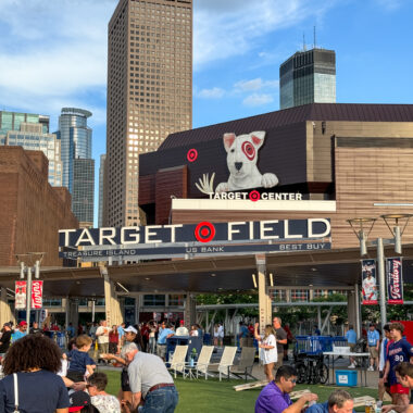 People relaxing and doing activities on the Target Field Lawn.