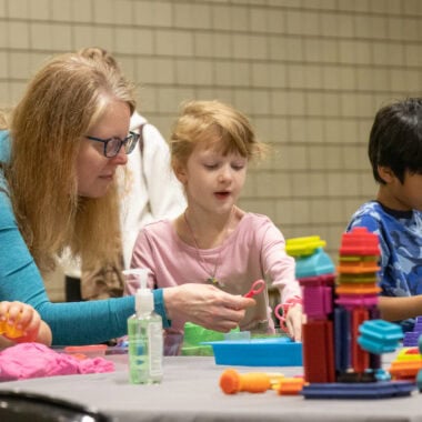 Adult and children creating art at Fraser Festival.