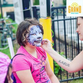 Girl getting face paint done.