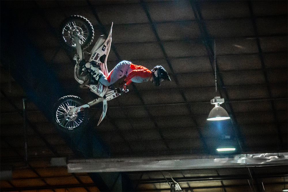 Monster X Tour Motorcycle in the air.