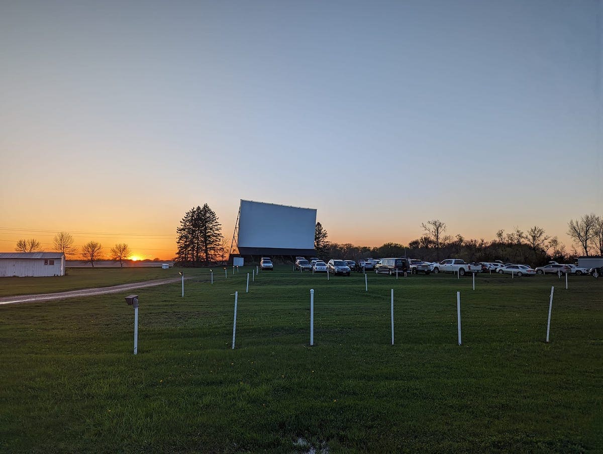 Star Lite drive in screen and field of cars.