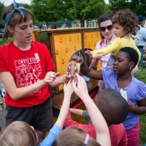 Open Eye Theatre puppet and kids interacting.