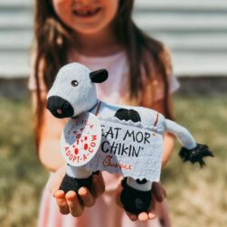 Chick-fil-A plush cow and little girl.