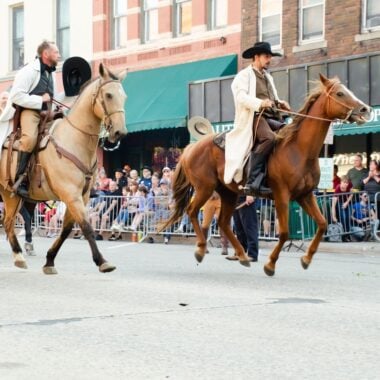 Jesse James Days actors on horses.