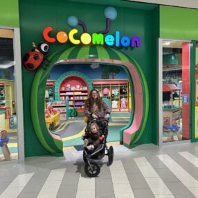 Front door at CoComelon playdate with mother and child.