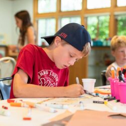 Boy working on art at Edina Art Lab.